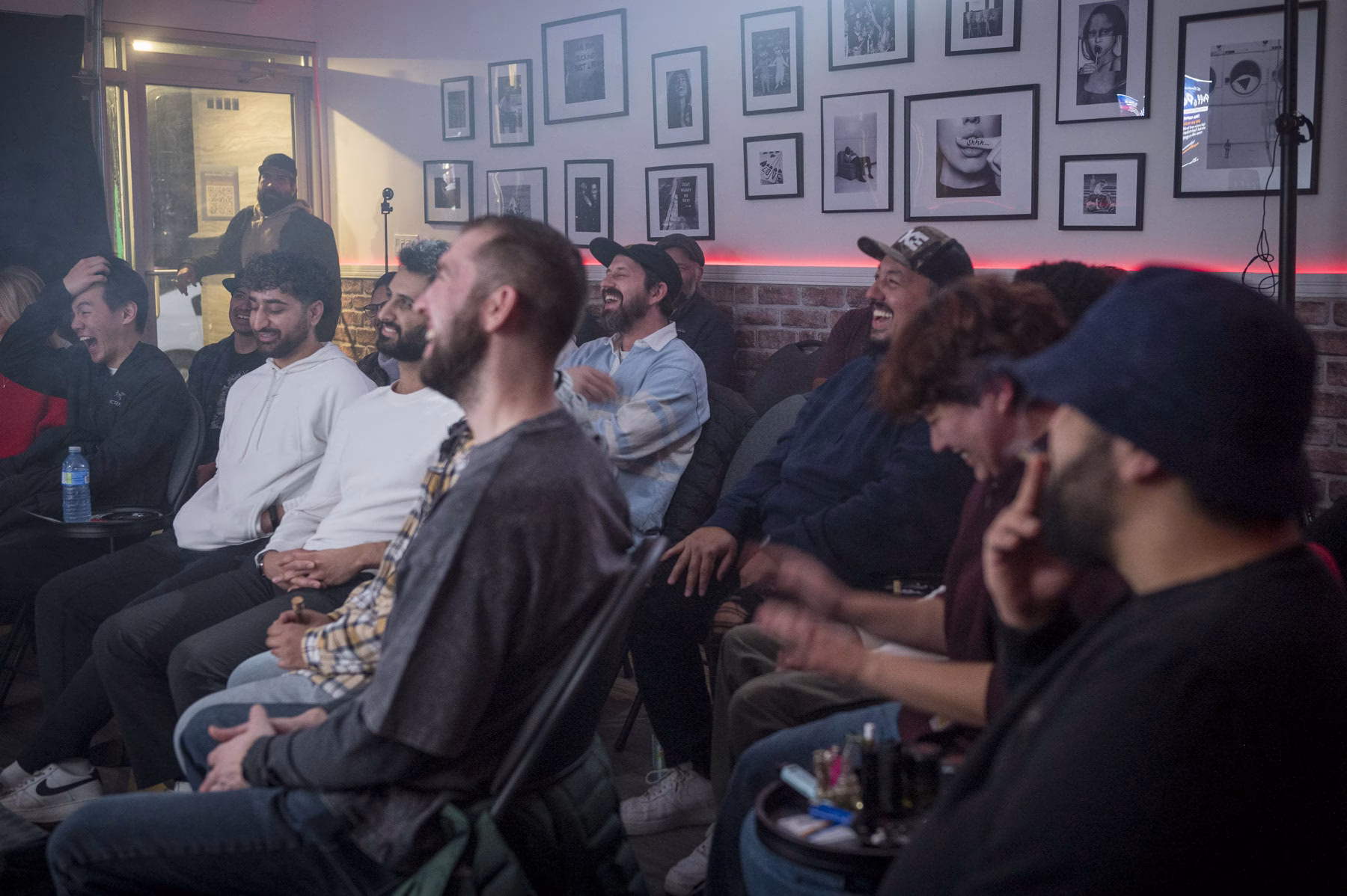 A laughing crowd at a stand-up comedy show at The Boardroom Comedy Club in Toronto