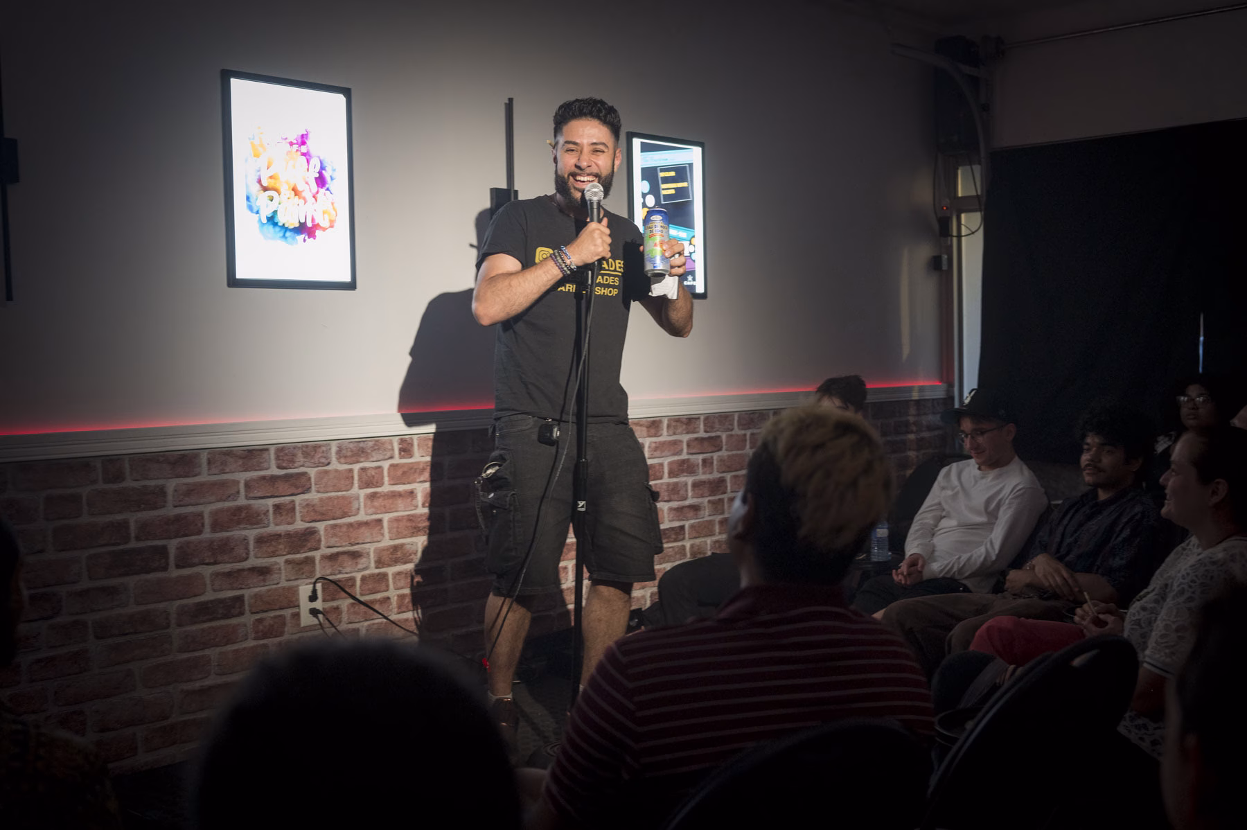 Stand-up comedian on stage at The Boardroom on St. Clair
